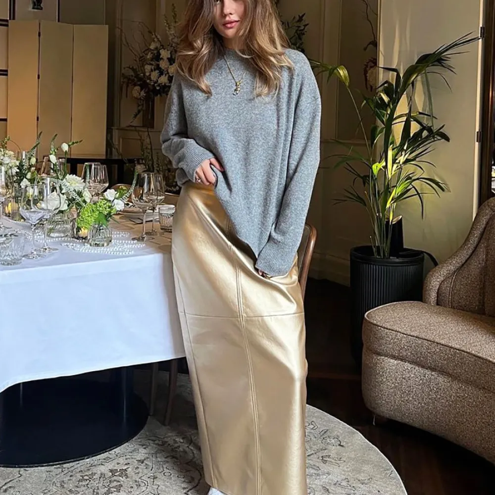 Gonna in pelle PU e gonna da donna con rivestimento sui fianchi in pelle lucida metallizzata con cuciture a fessura primaverile