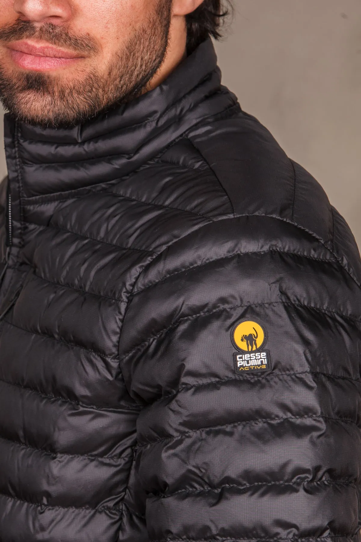 Piumino uomo trapuntato logo sulla spalla. RANGE 4.0225CAMJ20139ASPHALT